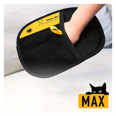A hand wears a black mesh pet hair removal glove with a yellow branded label.