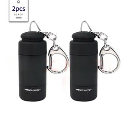 Two black portable LED keychain flashlights with metal clips and USB charging ports.