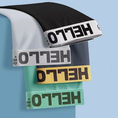 A stack of four men's ice silk boxer shorts in black, grey, yellow, and green with Hello waistbands.