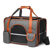 A grey and orange soft-sided pet carrier with mesh windows and pockets on a white background.