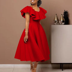 A woman wears a red mid-calf A-line dress with a round neckline and ruffled butterfly sleeves.