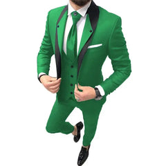 A man wears a slim-fit, three-piece green suit with a black shawl lapel and a matching tie.