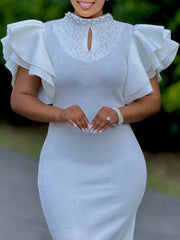 A white knee-length pencil dress featuring butterfly sleeves, a high collar, and pearl detailing.