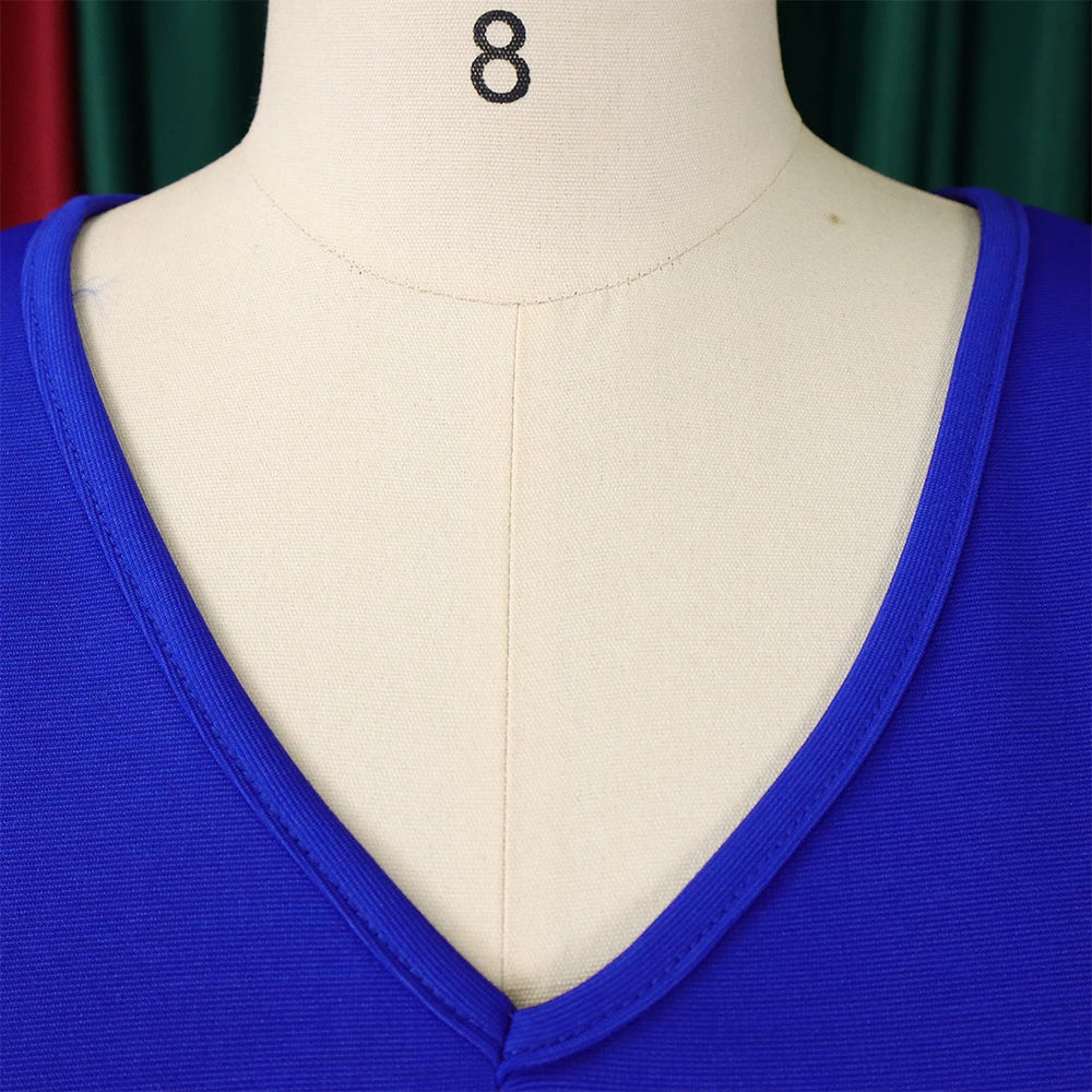 A close-up of a royal blue dress featuring a V-neckline with finished trim on a mannequin.