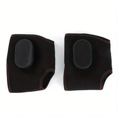 A pair of black, wireless, portable foot massagers with red stitching and integrated heating pads.