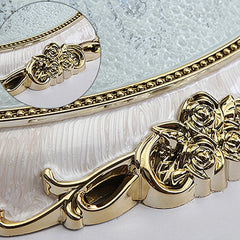 A round ceiling light featuring a textured glass center and a decorative gold rose trim.