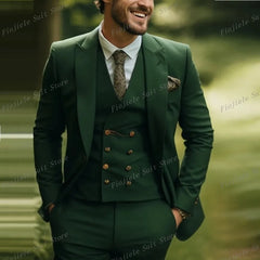 A man wears an army green three-piece suit with a vest, jacket, and patterned tie.