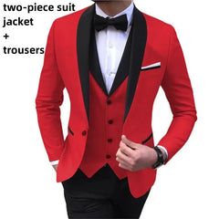 A man wears a red blazer with a black shawl lapel and matching trousers.