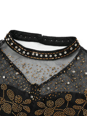 A black mesh evening gown featuring a high neckline adorned with gold beads and clear crystals.