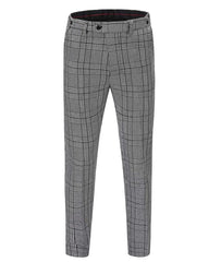 A pair of grey and black houndstooth patterned skinny trousers with a zipper fly.