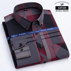 A long-sleeved men's button-down shirt featuring a red and black plaid pattern with solid grey accents.