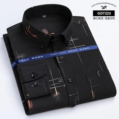 A black long-sleeve men's shirt with a gold-toned geometric print and a button-down collar.
