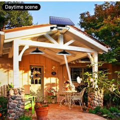 A solar-powered double-head pendant light is mounted under a porch roof during the day.