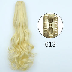 A long, blonde, wavy synthetic ponytail hair extension with a claw clip attachment.