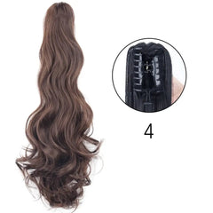A long, wavy brown synthetic ponytail hair extension with a claw clip attachment.