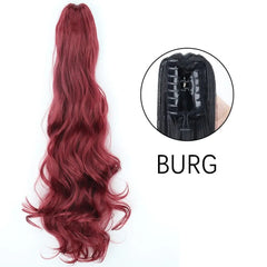 A long, wavy burgundy ponytail hair extension with a claw clip attachment.