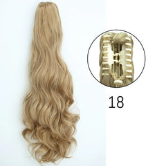 A long, wavy blonde ponytail hair extension with a claw clip attachment.
