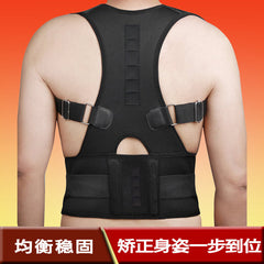 A person wears a black posture corrector brace with adjustable straps and a wide lumbar support belt on their back.
