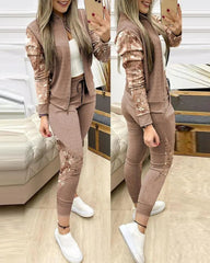 A woman wears a brown two-piece tracksuit featuring sequined sleeves and side leg panels.