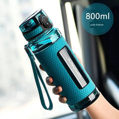 A teal 800ml UZSPACE sports water bottle with a textured grip and a carrying strap.