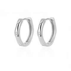 A pair of silver-toned, U-shaped square hoop earrings featuring three small embedded stones.
