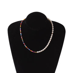 The Vintage Style Simple 6MM Pearl Chain Choker Necklace for Women features half white pearls and half vibrant red, blue, yellow, pink, and orange beads for a playful yet elegant touch—perfect for weddings, parties, or everyday fashion.