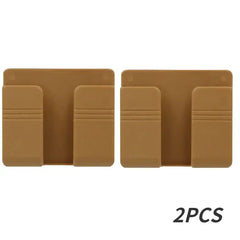 Two brown, wall-mounted plastic mobile phone holders shown side by side.