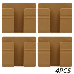 Four brown wall-mounted mobile phone holders arranged in a grid.