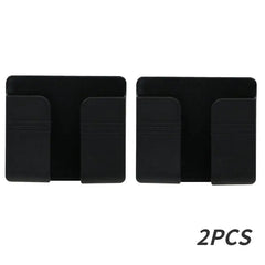 Two black wall-mounted mobile phone holders made of plastic.
