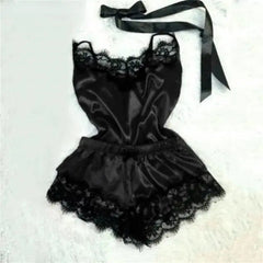 A black satin pajama set featuring a sleeveless camisole and shorts with delicate lace trim.