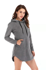 Woman wearing Showlu Womens Cotton Sports Hoodie, long gray sweatshirt with black drawstrings and front pockets on white background.