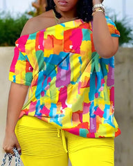 A woman wears the Womens Two Piece Sets Outfit—Melting Colors All Over Print Skew Neck Top & Shorts Set, a vibrant 2023 summer fashion with bright hues, styled with a necklace and bracelets.