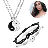 A matching jewelry set featuring yin and yang pendant necklaces and woven cord bracelets.