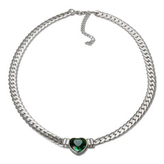 A silver-toned chain necklace featuring a central green heart-shaped pendant.