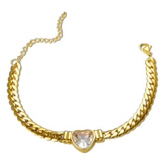 A gold-plated stainless steel chain bracelet featuring a central heart-shaped crystal pendant.