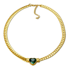 A gold-plated chain necklace featuring a central green heart-shaped pendant.