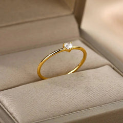 The Zircon Engagement Wedding Ring for women features a gold color stainless steel band with cubic zirconia, presented in a beige jewelry box—perfect as a 2023 birthday gift with free shipping.
