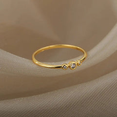 The Zircon Engagement Wedding Ring for women features gold color stainless steel and sparkling zircon stones, making it an elegant 2023 finger jewelry choice or birthday gift. Free shipping included.