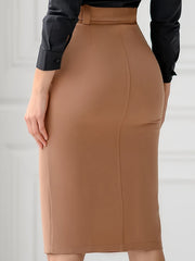 A high-waisted tan midi skirt with a matching belt and a back slit, worn with a black shirt.