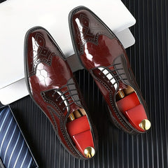 Glossy red men's brogue oxfords with a square toe and intricate wingtip detailing.