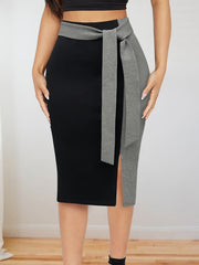 A slim-fit midi skirt featuring a black and grey color-block design with a tied waist detail.