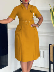 A mustard yellow V-neck dress featuring a belted waist, short sleeves, and a pleated skirt.