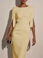 A pale yellow midi bodycon dress with a crew neck and pearl-trimmed split half sleeves.