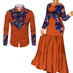 A man's long-sleeved shirt and a woman's long maxi dress in matching orange and patterned fabric.