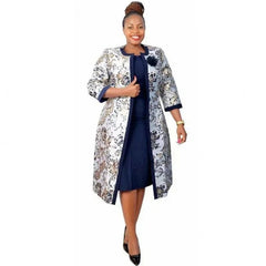 A woman wears a navy blue knee-length dress paired with a floral print long-sleeved coat.