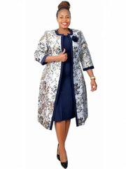 A woman wears a navy blue knee-length dress paired with a floral print open-front coat.