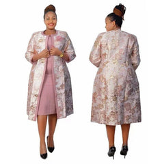 A woman models a two-piece set featuring a solid pink dress under a floral print long coat.