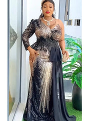 A woman wears a one-shoulder black and gold sequined evening gown with a peplum waist.