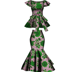 A two-piece set featuring a green and pink floral print peplum top and a matching mermaid skirt.