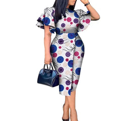 A woman wears a knee-length African wax print dress with butterfly sleeves and a circular pattern.